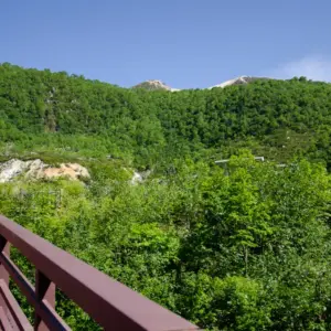 The summit of Mt. Iwaonupuri visible from the bridge at the trailhead entrance.