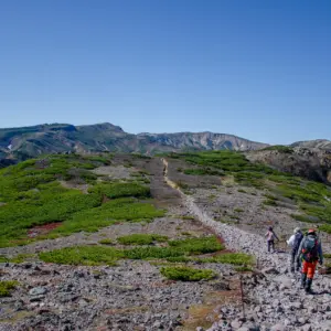 Climbing Mount Kurodake under the clear autumn sky